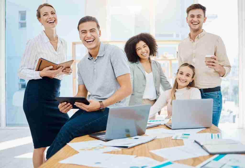 Team collaborating with laptops on a digital marketing project, Involve Digital Marketing blog, Jacksonville, FL