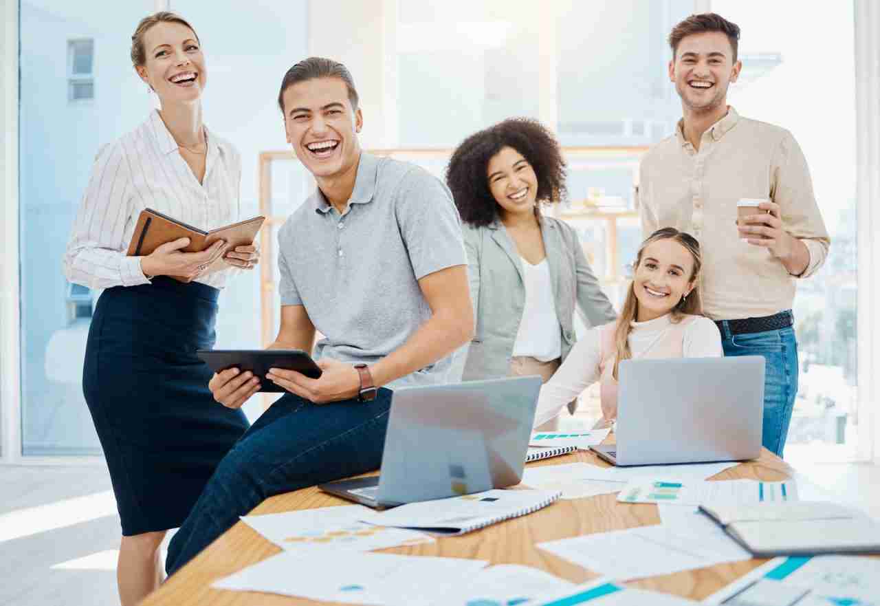 Team collaborating with laptops on a digital marketing project — Involve Digital Marketing blog, Jacksonville, FL